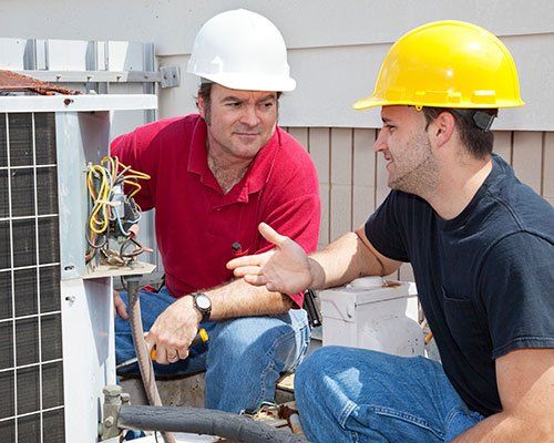 Professional HVAC Technician Working on Air Conditioning Unit