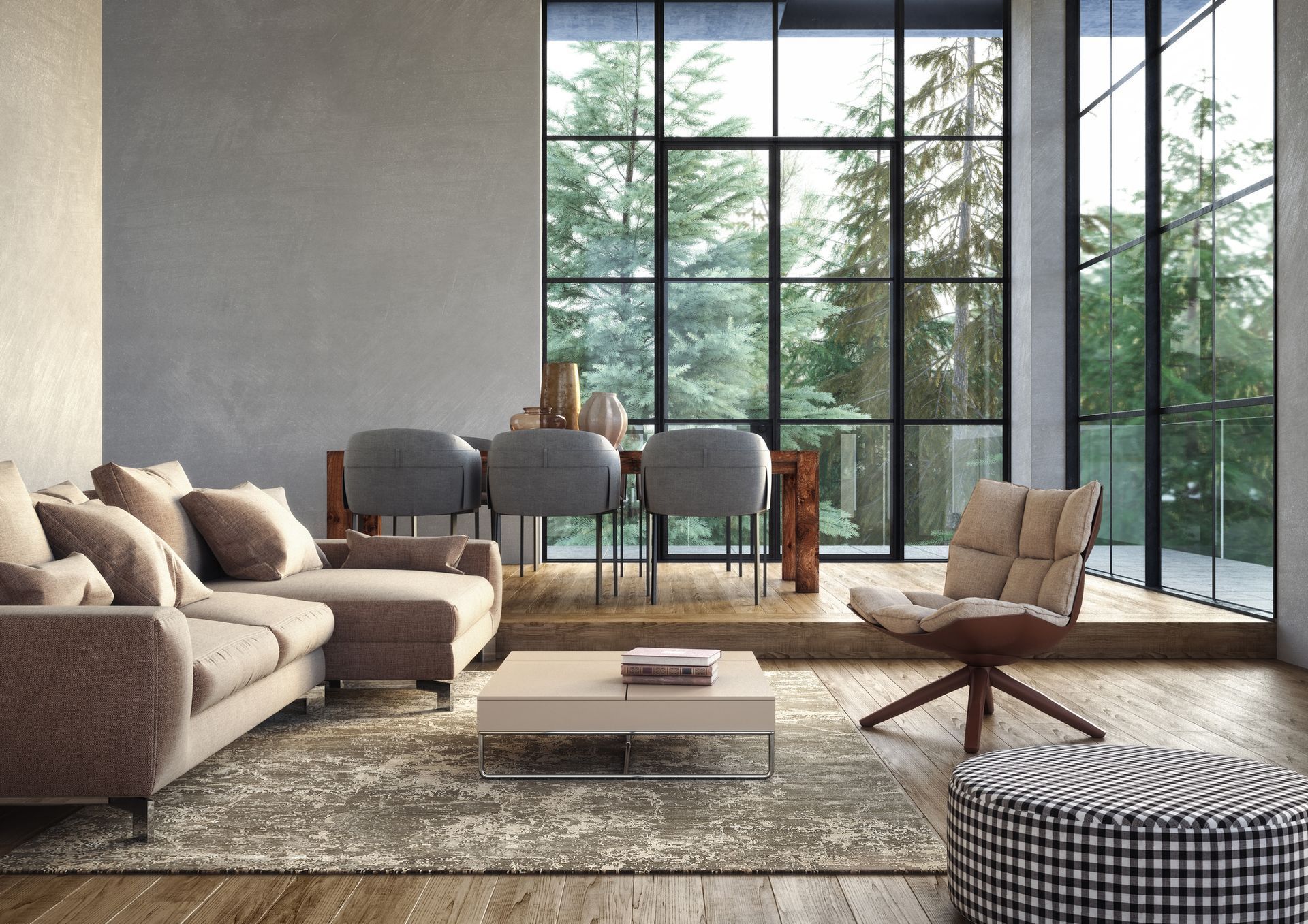 Living room with floor-to-ceiling windows overlooking trees. Includes a couch, dining table, chairs, and patterned rug.