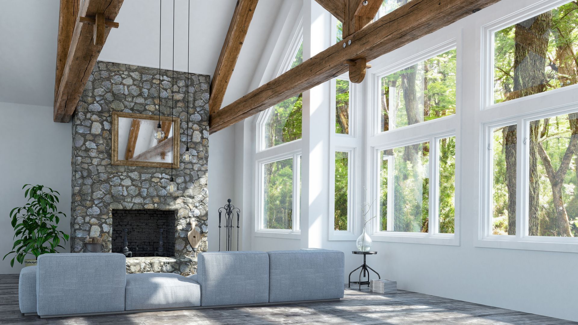 Living room with stone fireplace, large windows, wooden beams, and a gray sofa. Living room with stone fireplace, large windows, wooden beams, and a gray sofa.