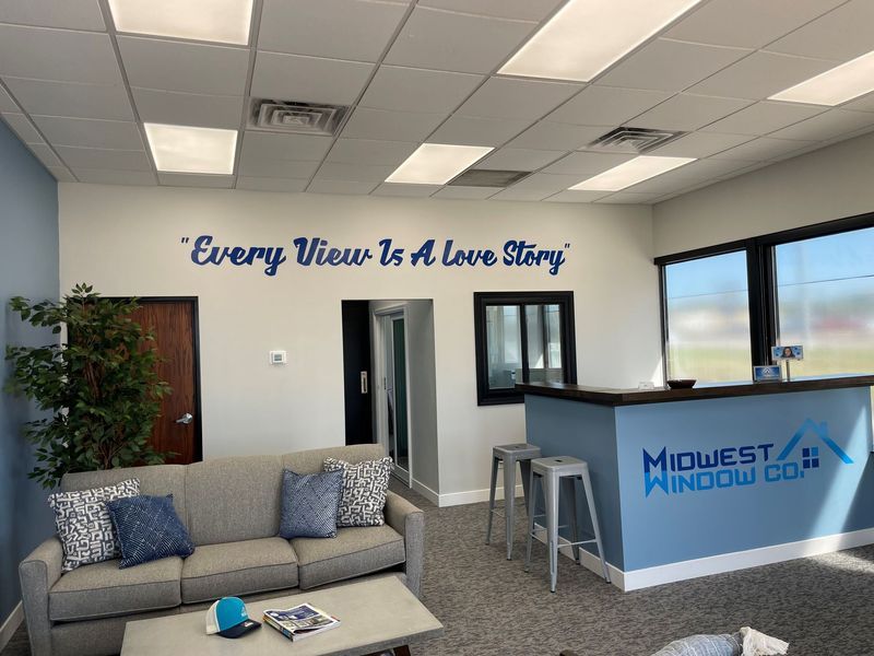 Interior of Midwest Window Co. showroom with blue accent wall, 