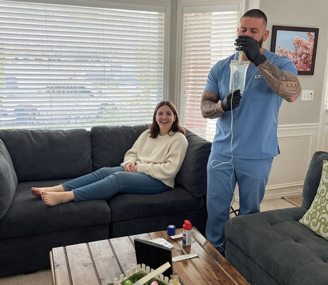 AQUA MD nurse providing in-home mobile IV therapy to a patient in Gig Harbor, WA