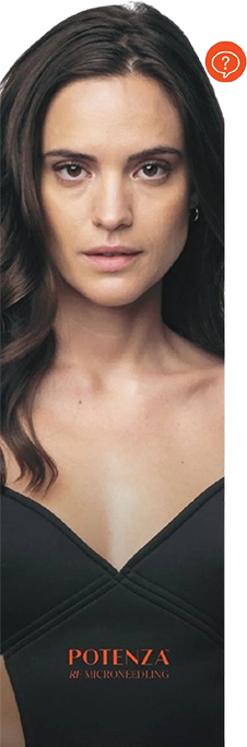 Portrait of a woman with dark hair in a black V-neck top on a dark background, looking directly ahead