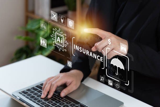 A Person Is Using a Laptop Computer and Pointing at A Screen that Says Insurance .