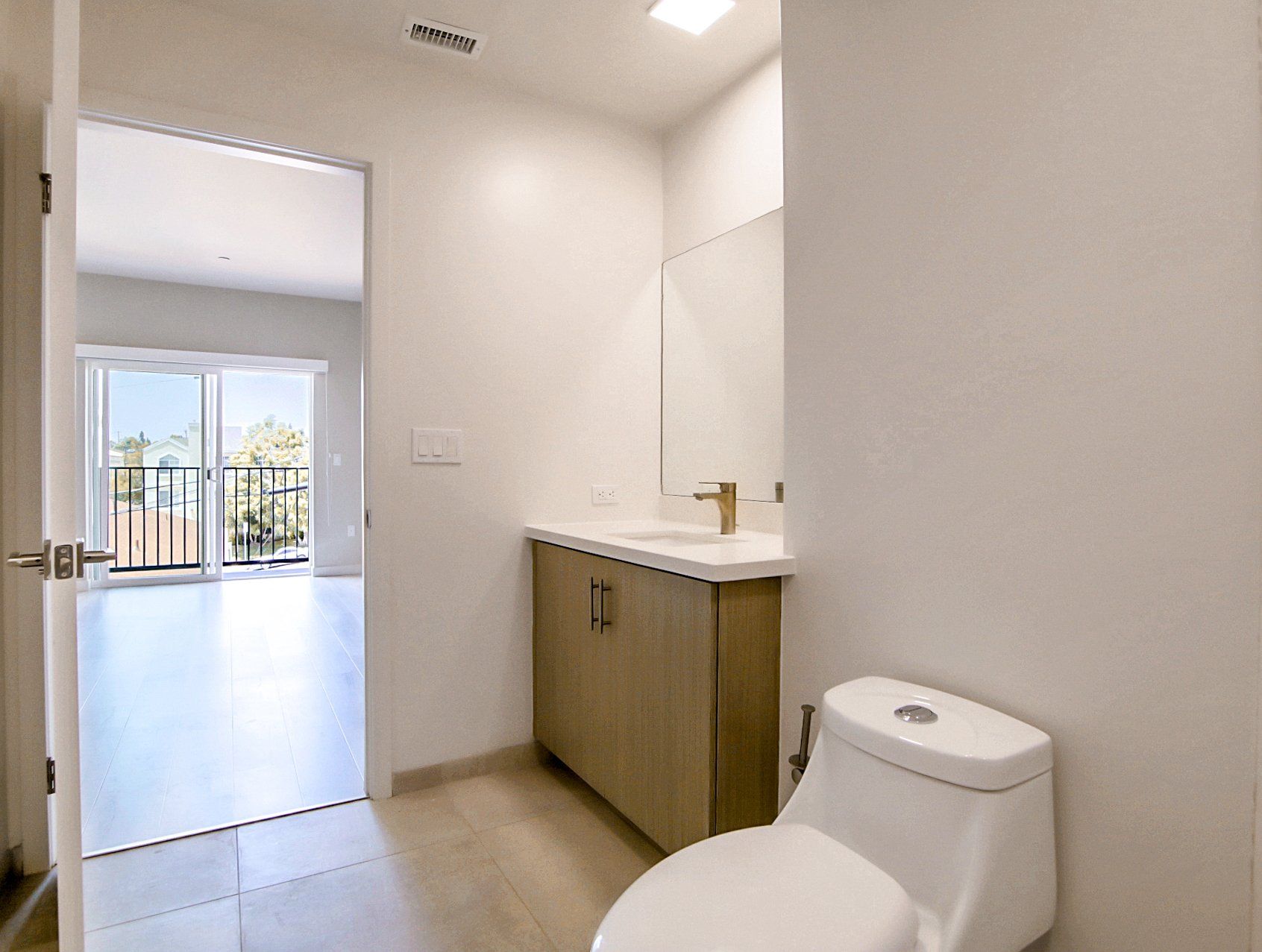 Interior of apartment bathroom with modern finishes.