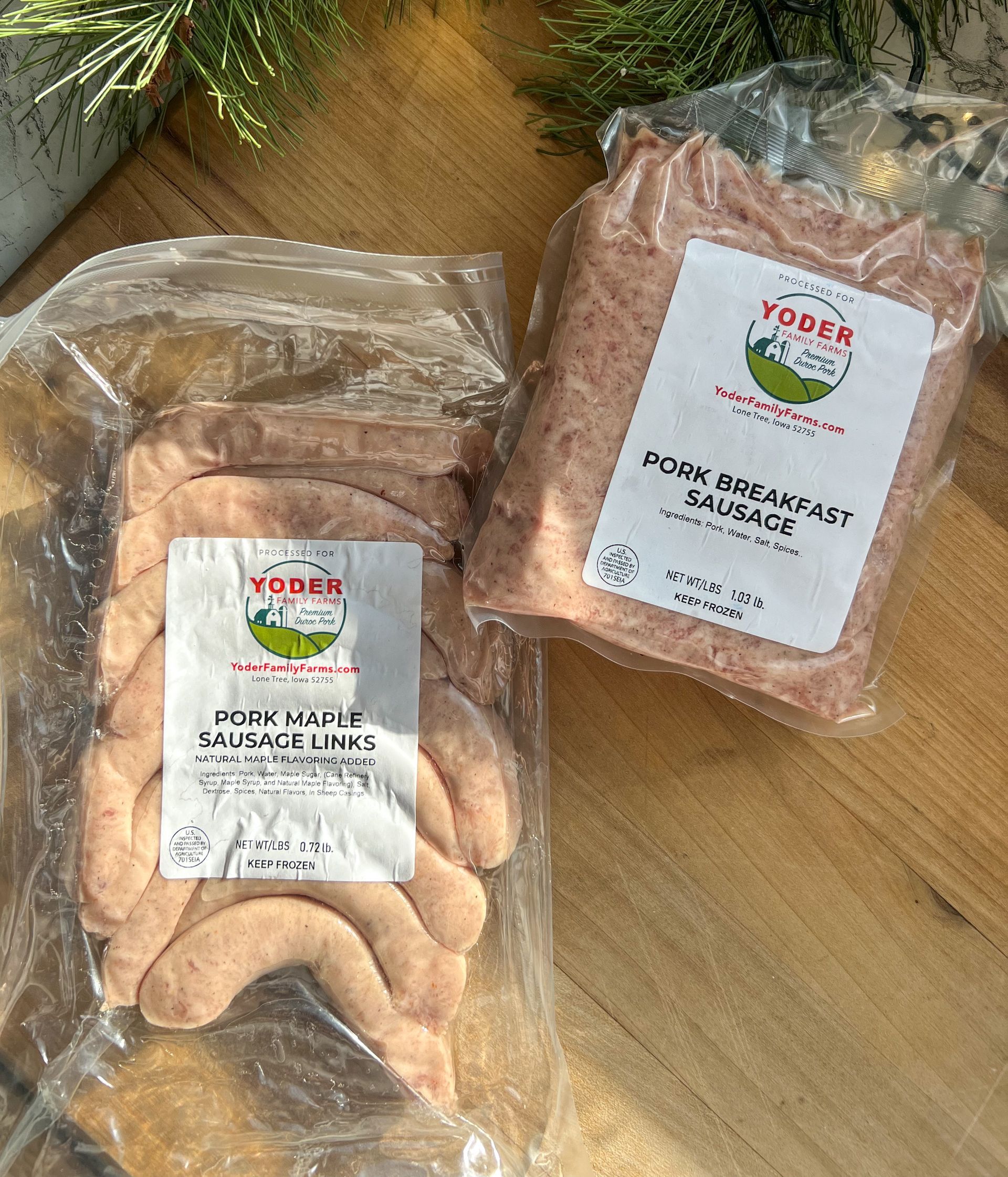 Two bags of sausage are sitting on a wooden table.