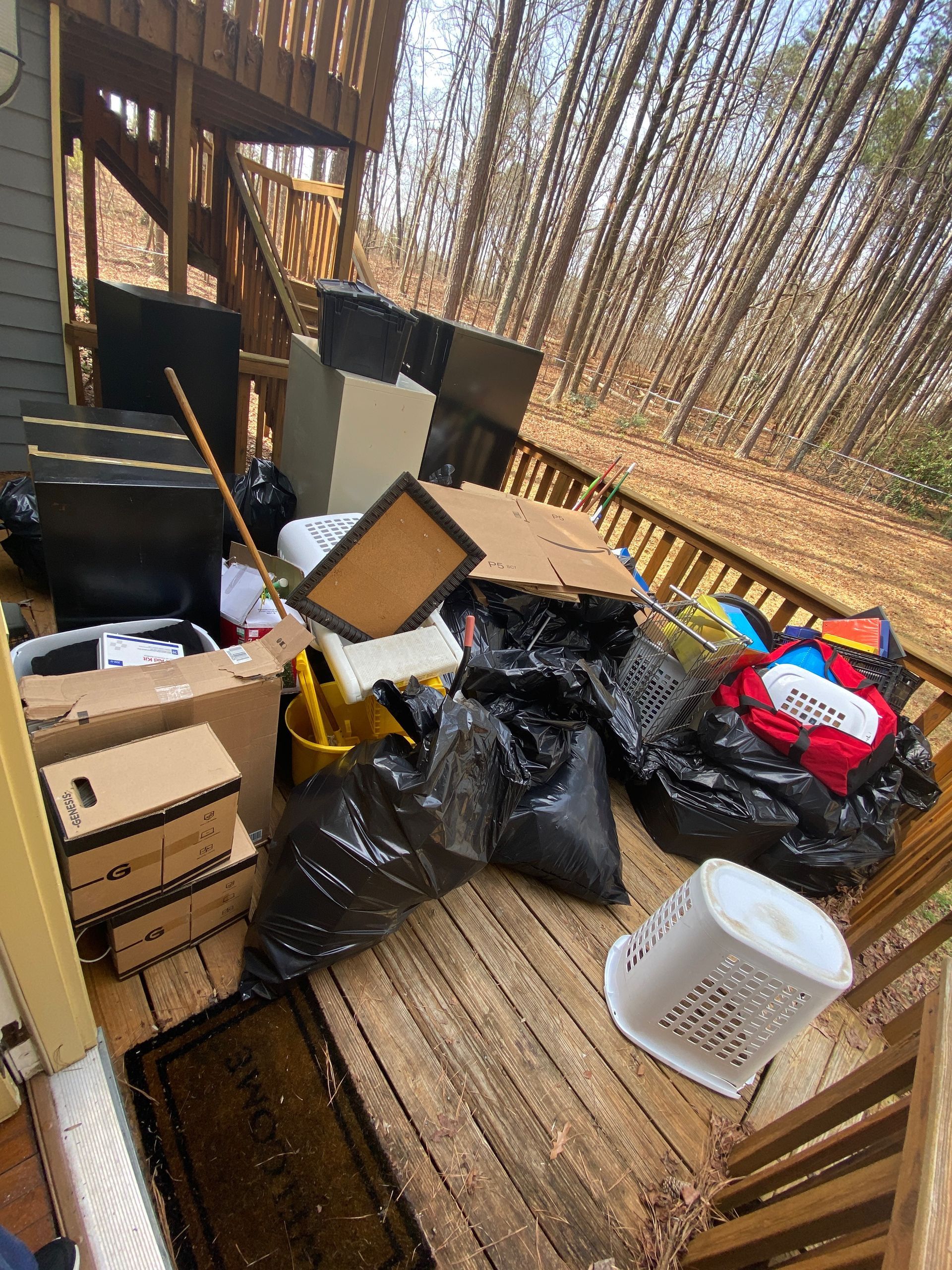 There is a lot of trash on the deck of a house.