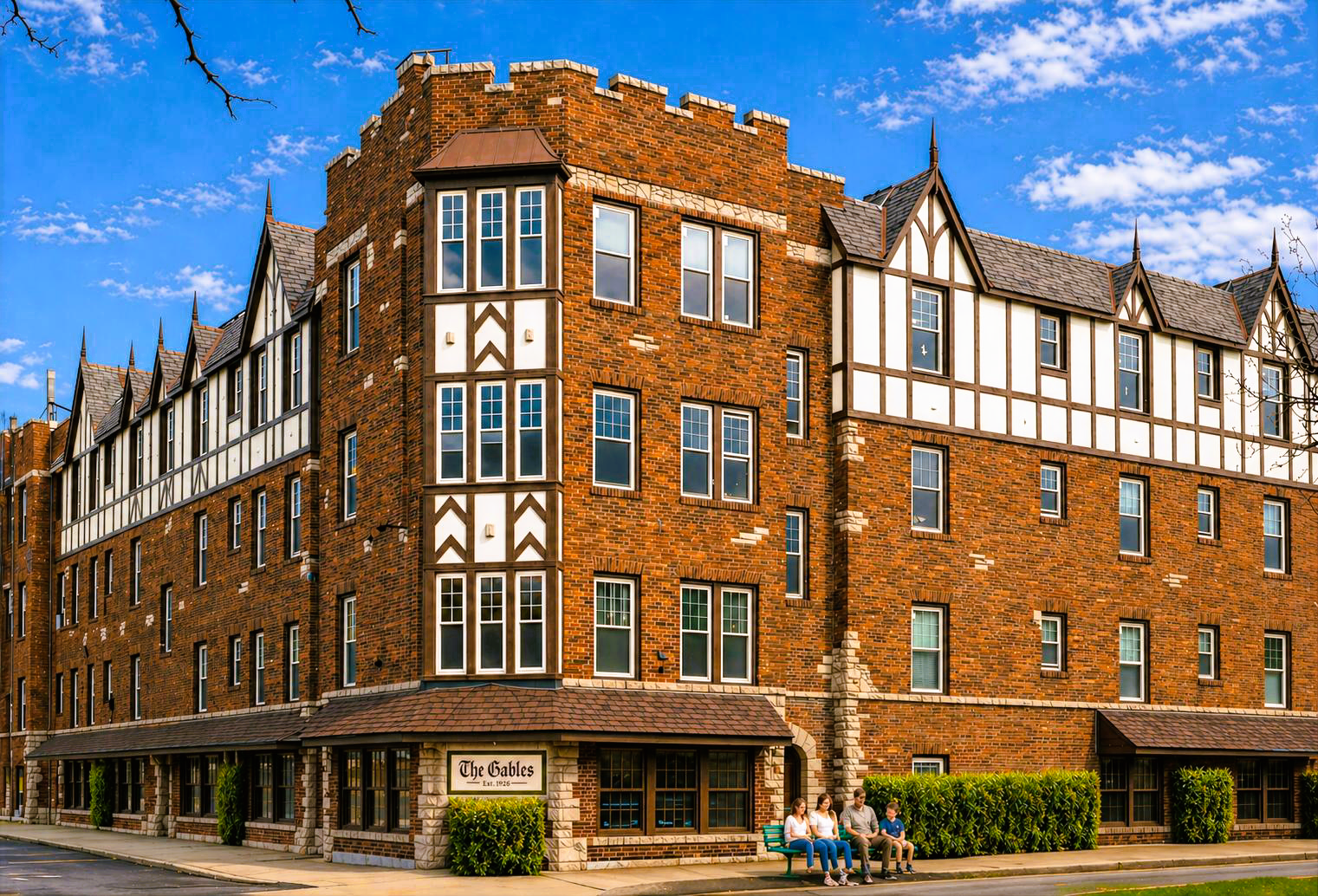 Historic brick and timber-framed building on a street corner under a blue sky
