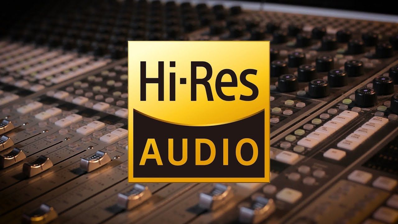 Amazon Music Unlimited Hi-Res Audio logo in gold over a blurry sound mixing console.