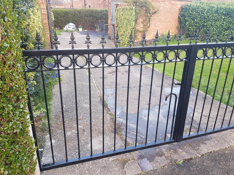 Hinged pair of metal driveway gates in Nottingham