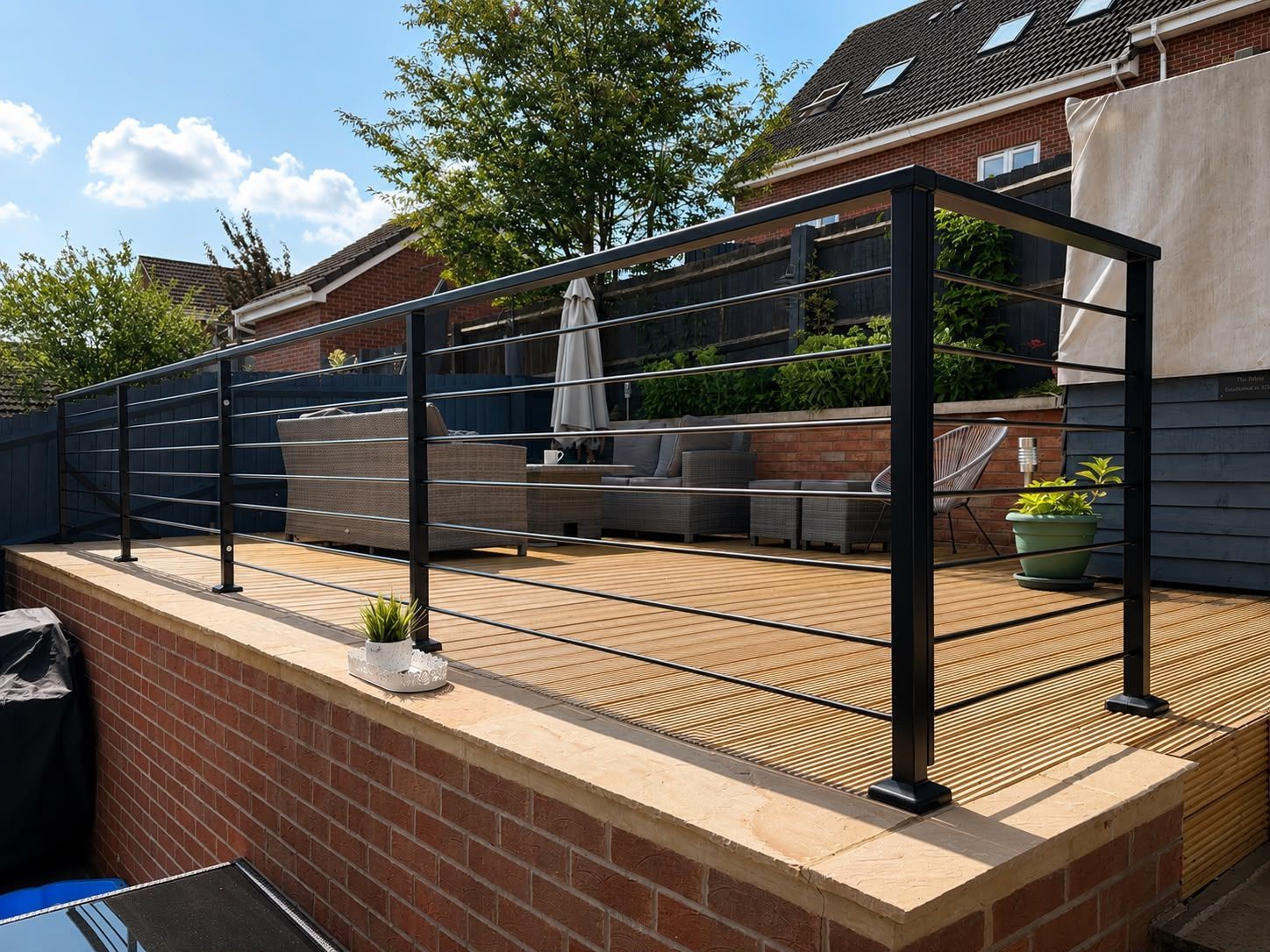 metal balustrade fitted onto a raised composite decking entertaining area in Nottingham
