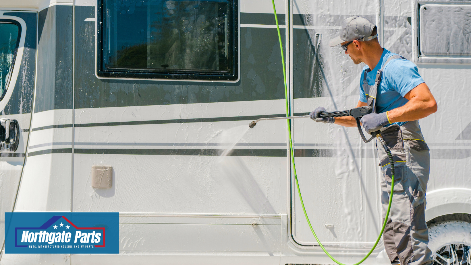 A man is fixing a window on a camper.