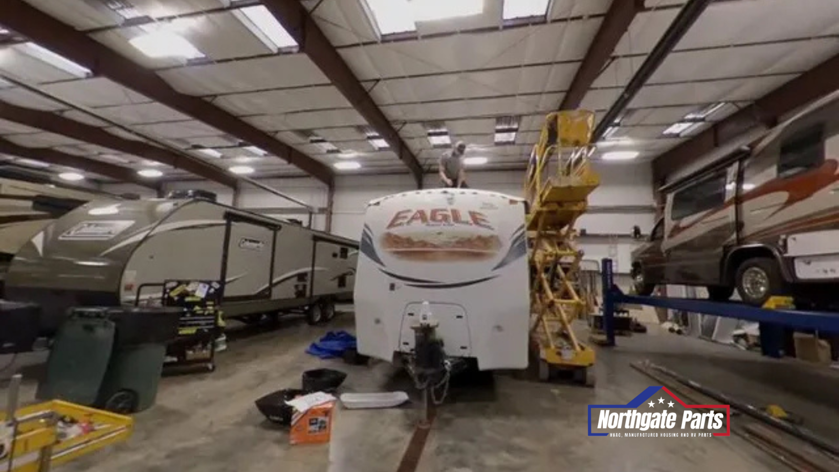 A white eagle rv is parked in a garage