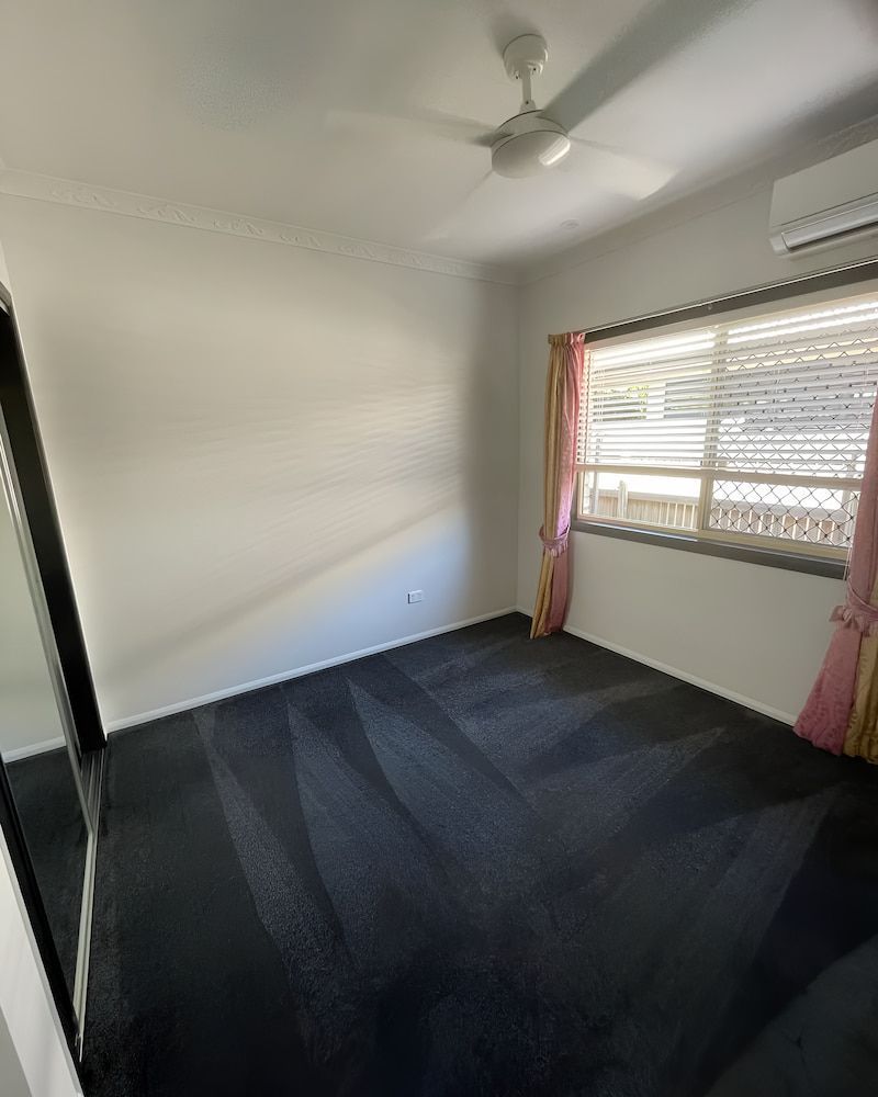 There Is A Ceiling Fan In The Room And A Large Window — Glittering Cleaning Service In Townsville, QLD