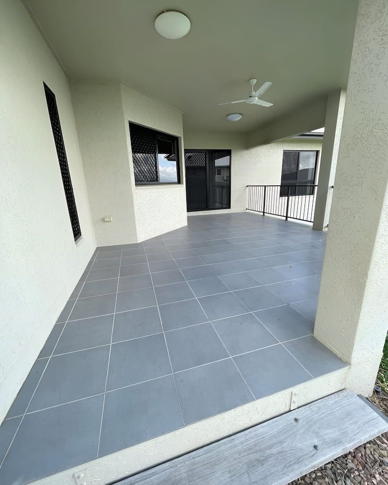There Is A Ceiling Fan On The Patio Of A House — Glittering Cleaning Service In Townsville, QLD