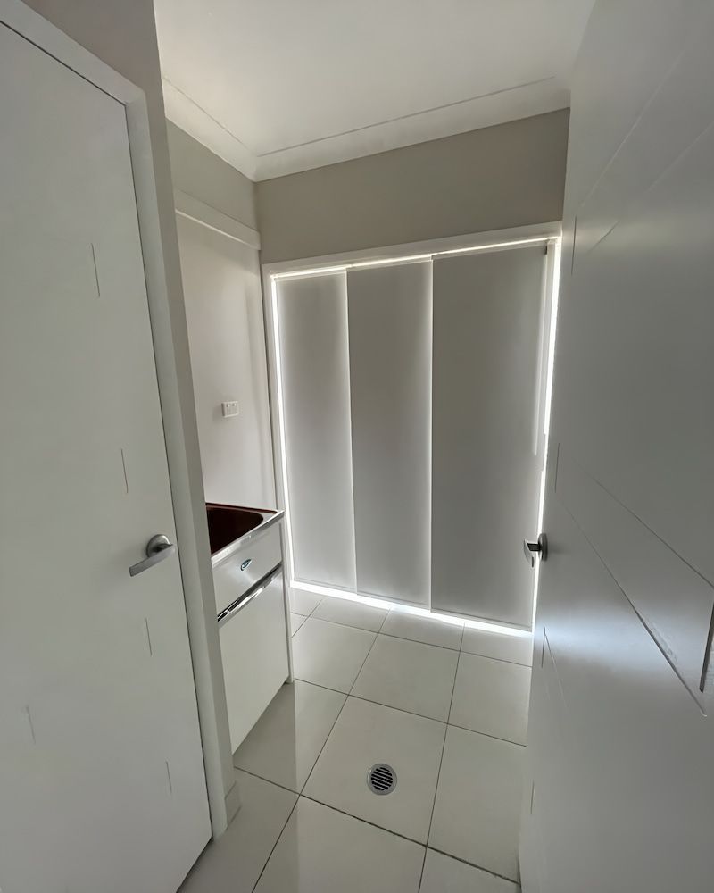 A Room With A Sliding Glass Door And A Sink — Glittering Cleaning Service In Townsville, QLD
