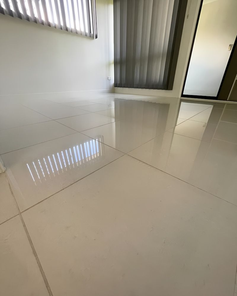 A White Tile Floor In A Room With A Window And Blinds — Glittering Cleaning Service In Townsville, QLD
