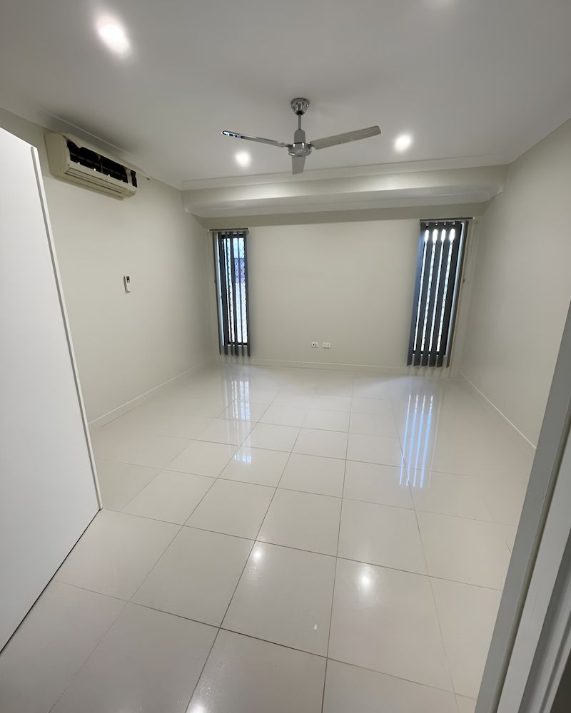 There Is A Ceiling Fan In The Middle Of The Room — Glittering Cleaning Service In Townsville, QLD