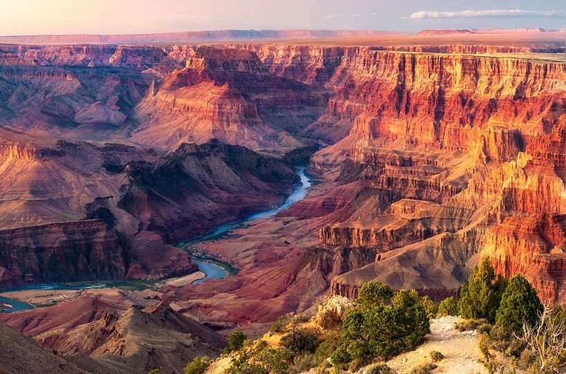 A river runs through a canyon in the grand canyon.