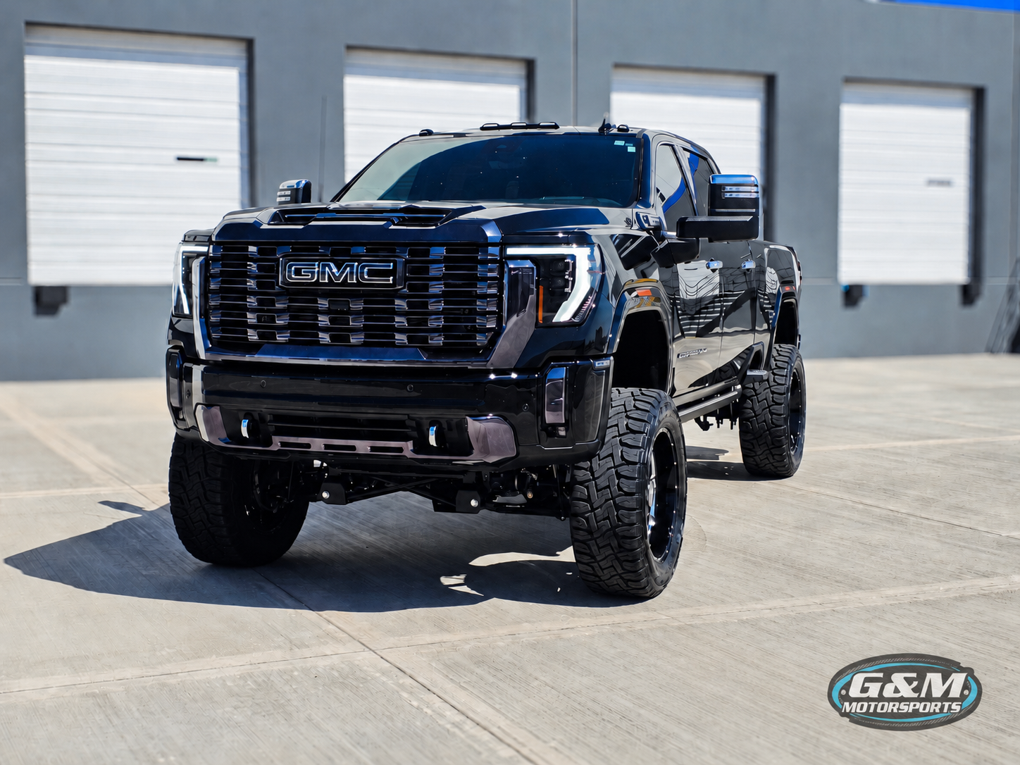 Lifted White Chevrolet Silverado Parked Outdoors | G & M Motorsports