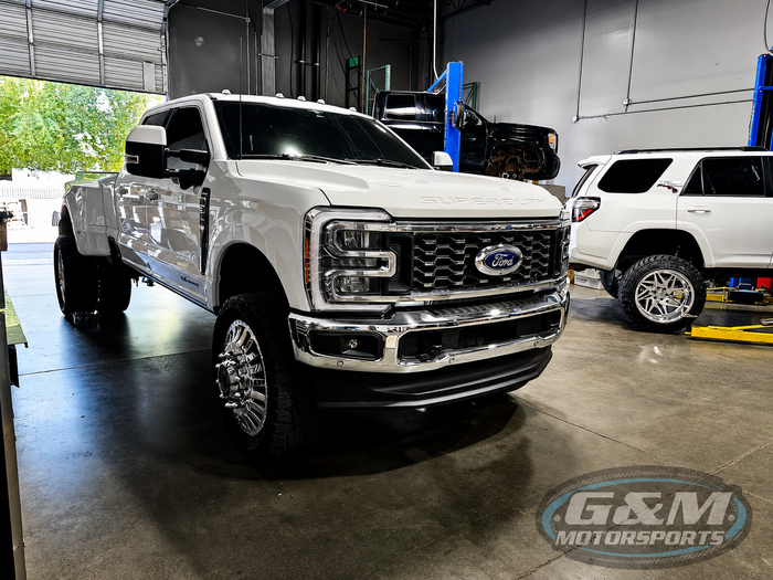 Black Lifted Truck Parked inside shop | G&M Motorsports