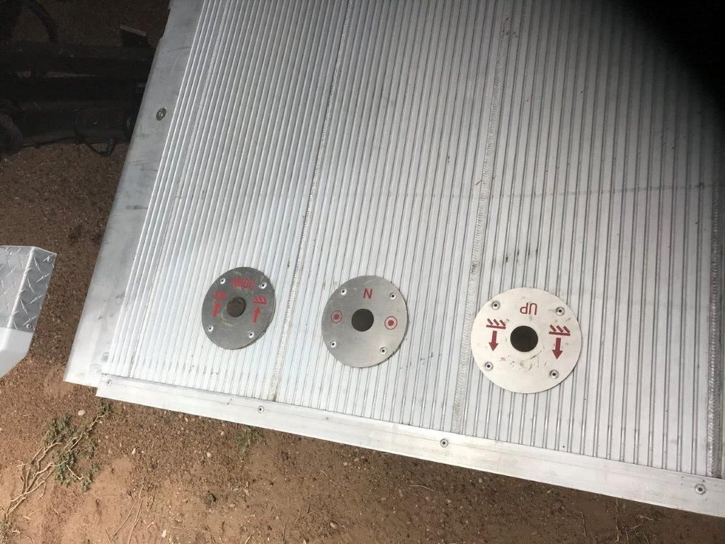 Corrugated aluminium trailer panel with three circular mounting fittings