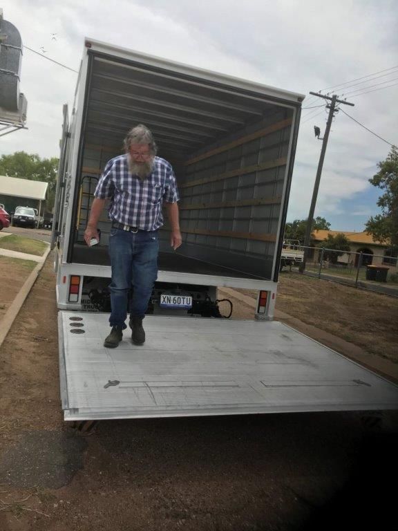 A man walking out of a truck in Emerald