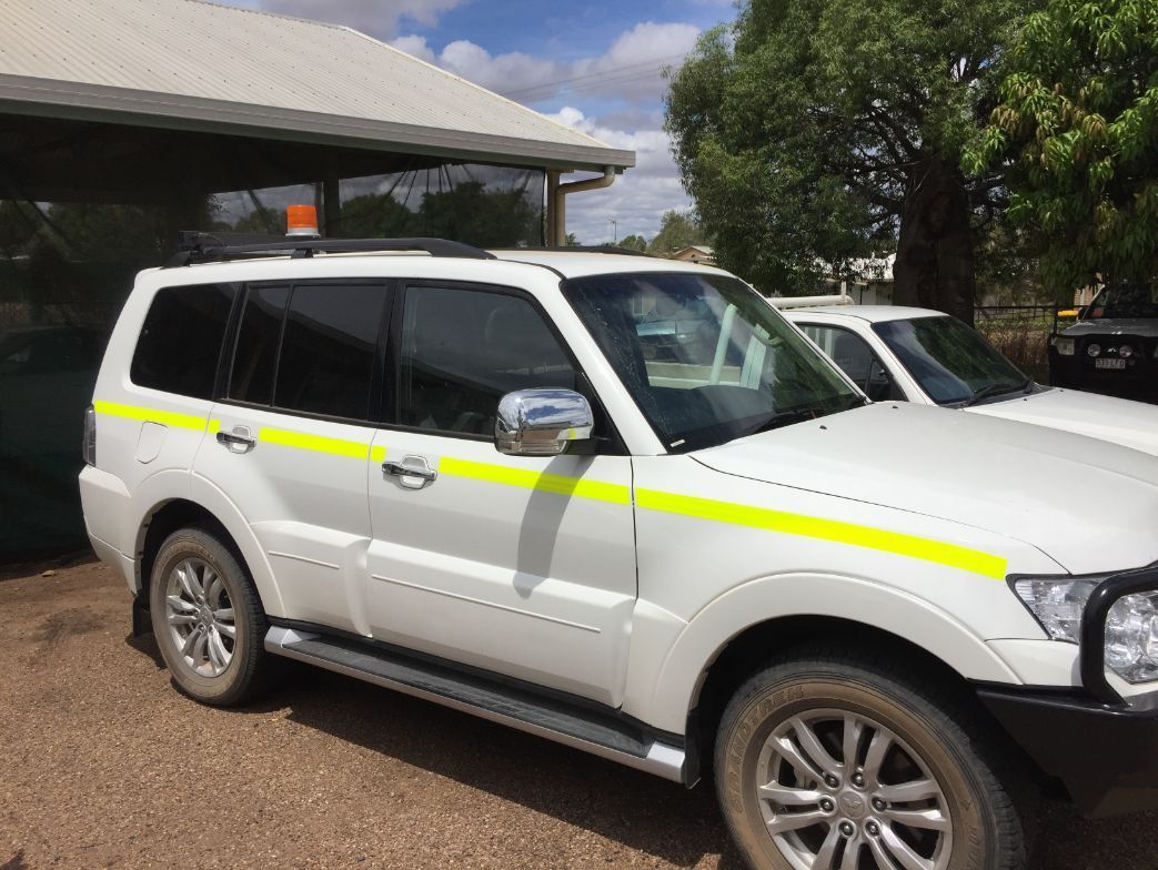 A White SUV  on the Side is Parked in Front of a Building — Locqal Car Truck Trailer Rentals in Emerald, QLD