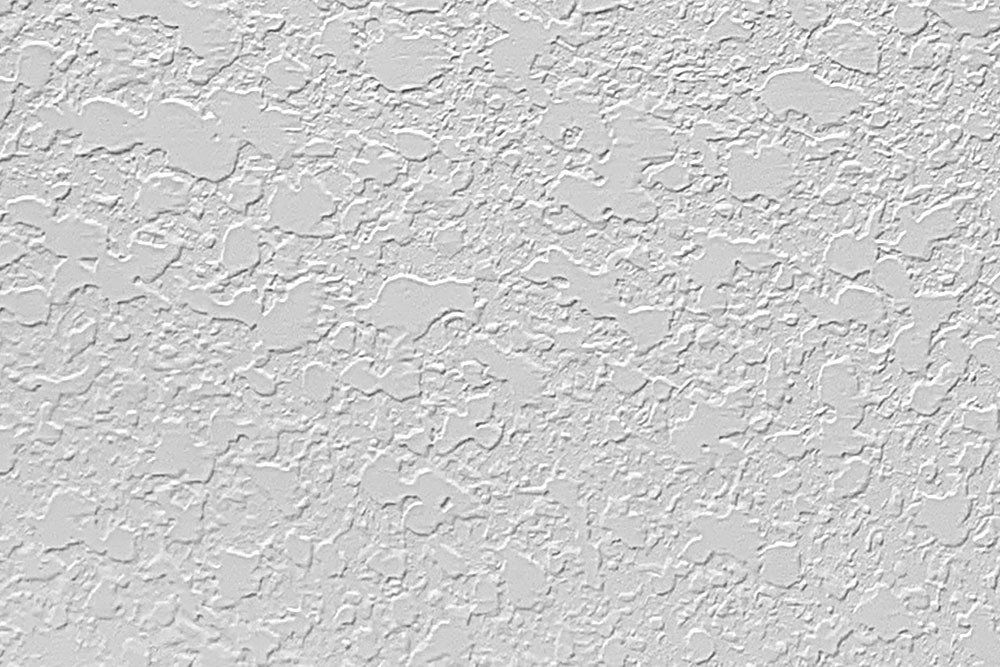 Textured gray wall with a stucco-like finish.
