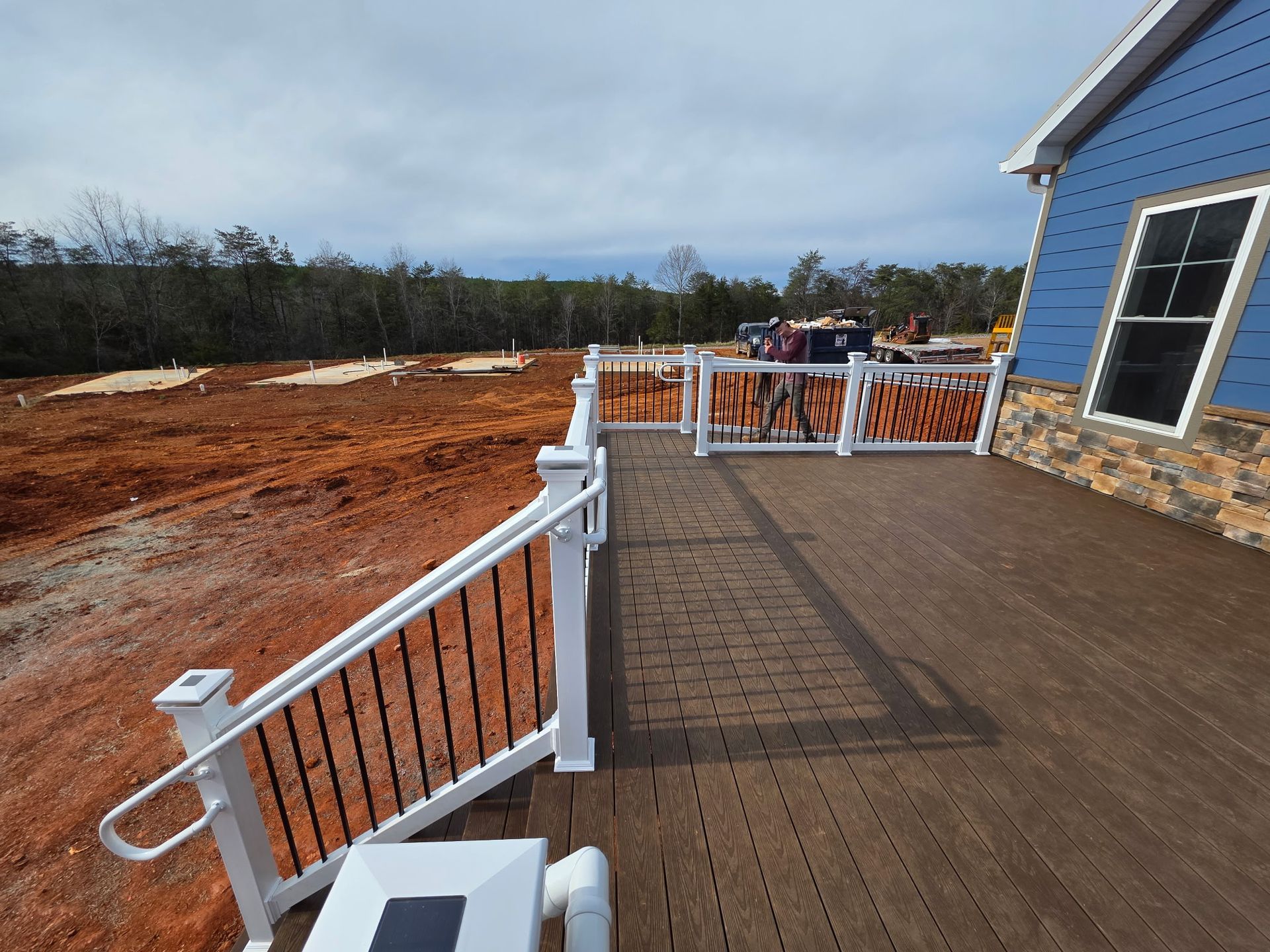 Composite decking installation with natural wood-look finish