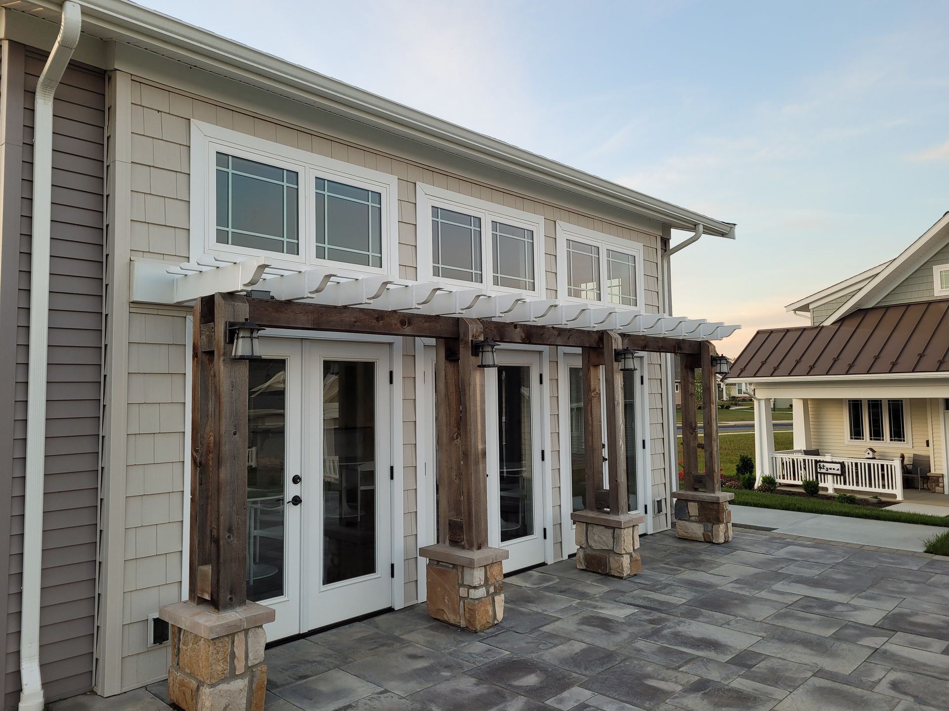 Durable vinyl railing and pergola installation for retirement community outdoor spaces