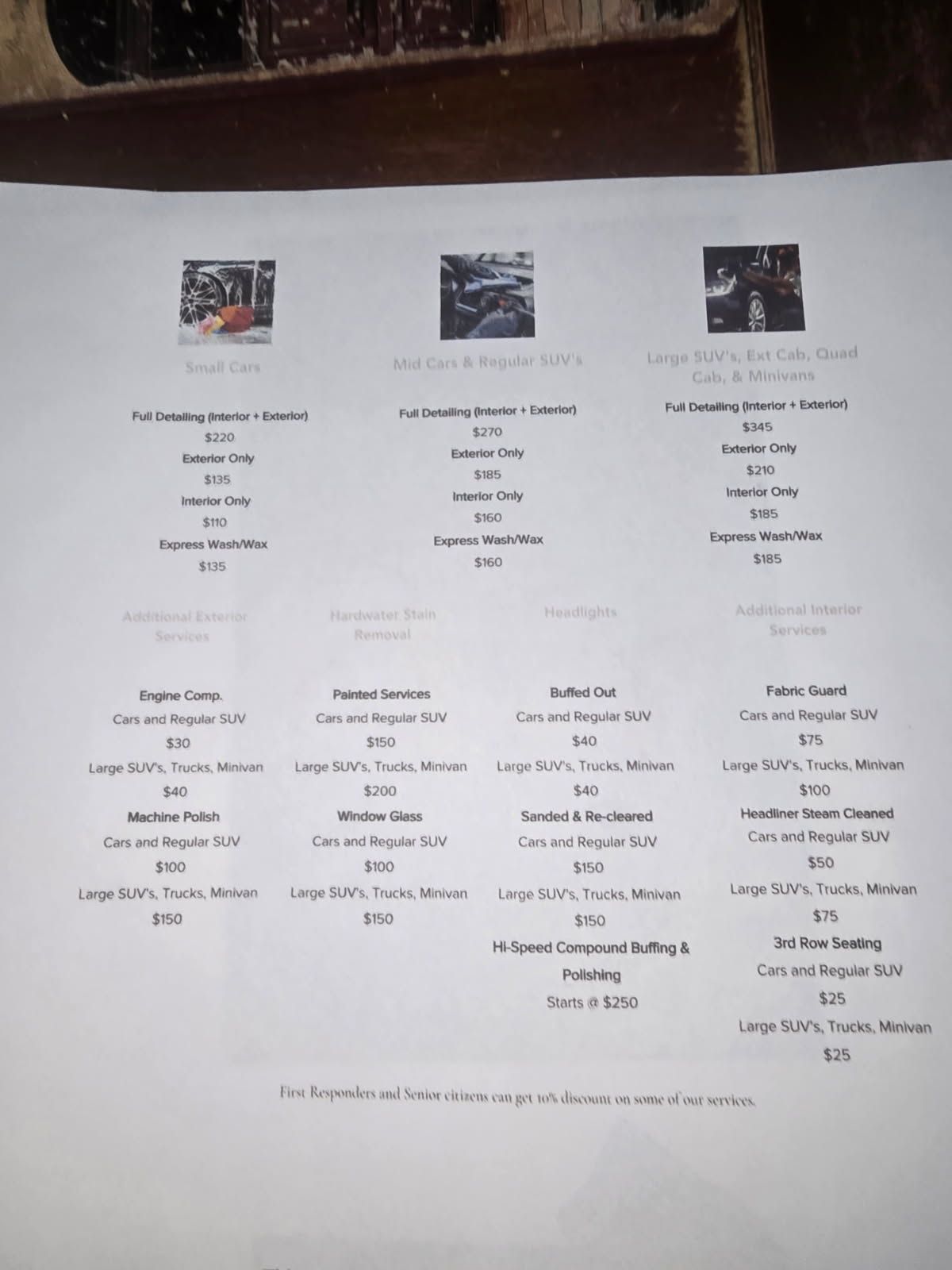 White printed menu or program sheet on a table, with small images and multiple text columns.