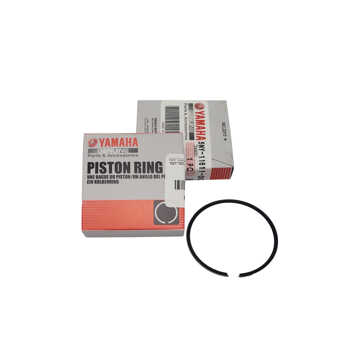 Two Yamaha piston ring boxes and a single piston ring.