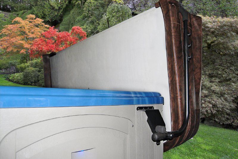 A hot tub is sitting on top of a lush green lawn.