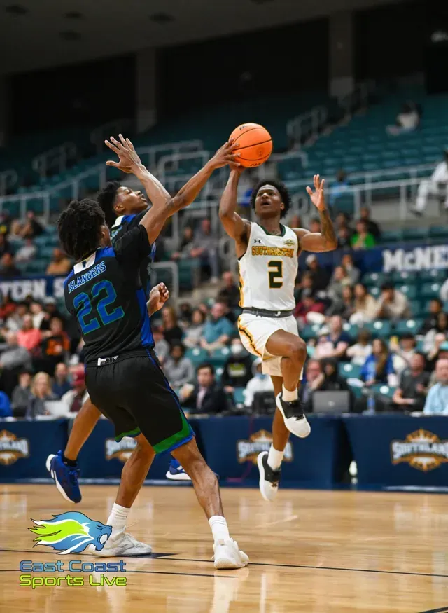 Basketball player in white shoots over a defender in black and blue during a game on a court