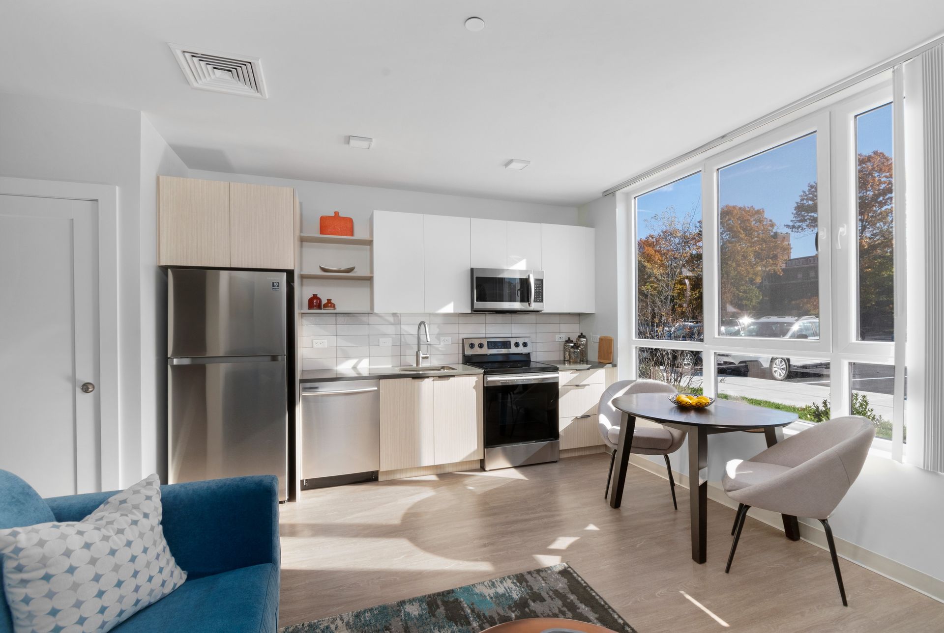 West End Yards spacious open floor plan with kitchen, dining area, and oversized windows. 