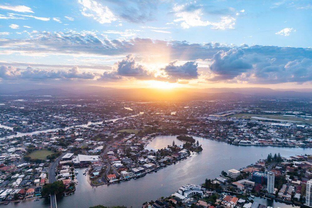 An Aerial View Of A City And A River At Sunset — Mudgeeraba Landscape Centre In Nerang, QLD