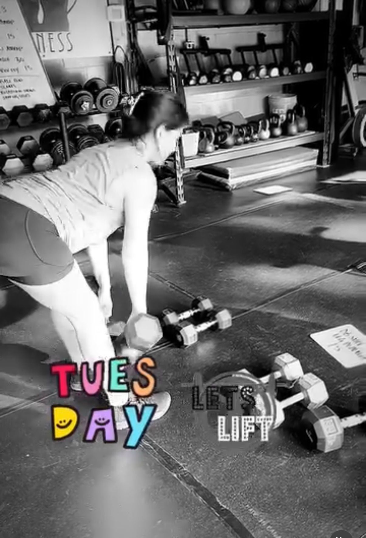Person deadlifting dumbbells in a gym, with colorful “TUESDAY” and “LET’S LIFT” text overlay