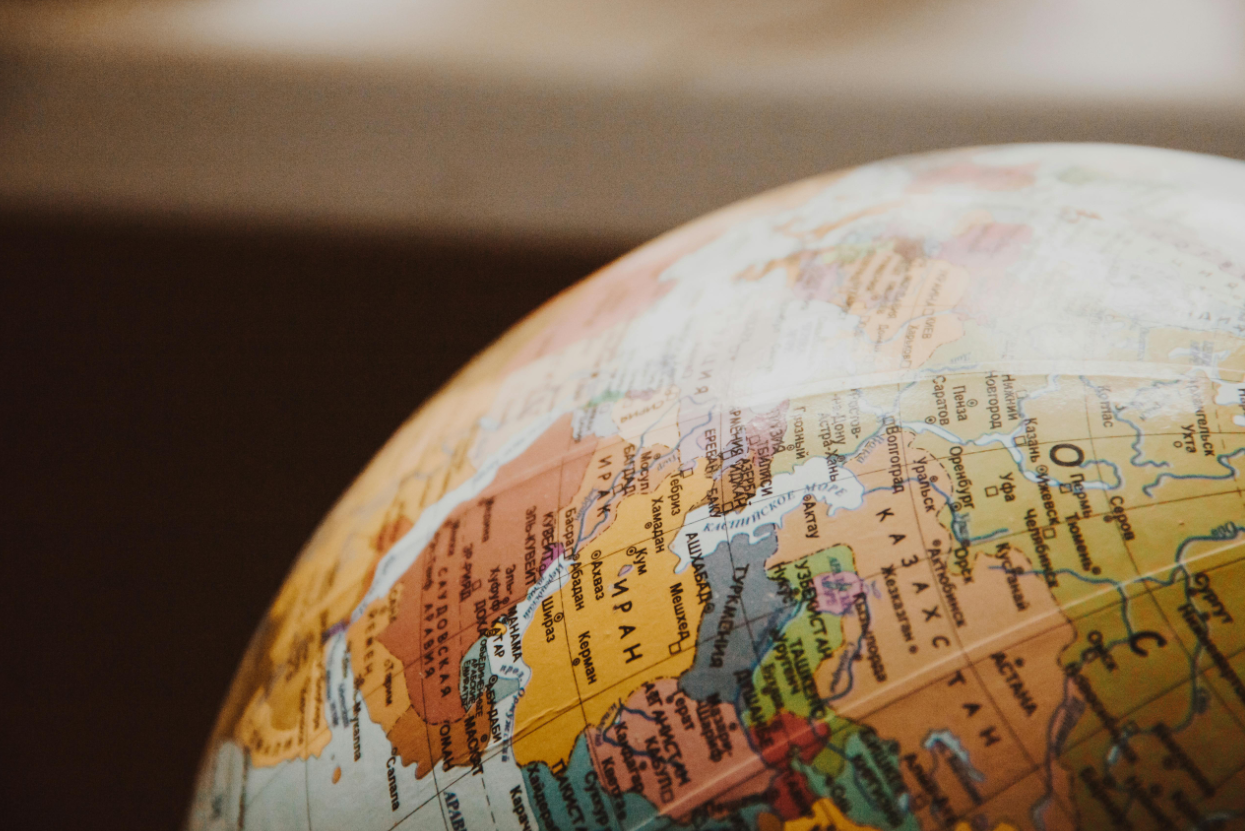 A close up of a globe on a table.