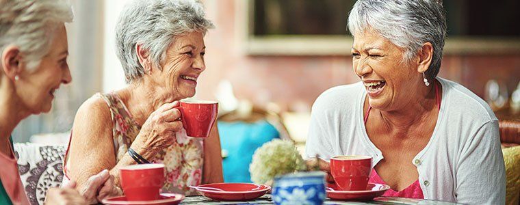 Old ladies are talking and laughing