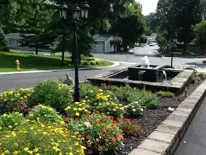 Garden with Flowers and a Fountain — Delaware, OH — Shroyer's Manufactured Homes