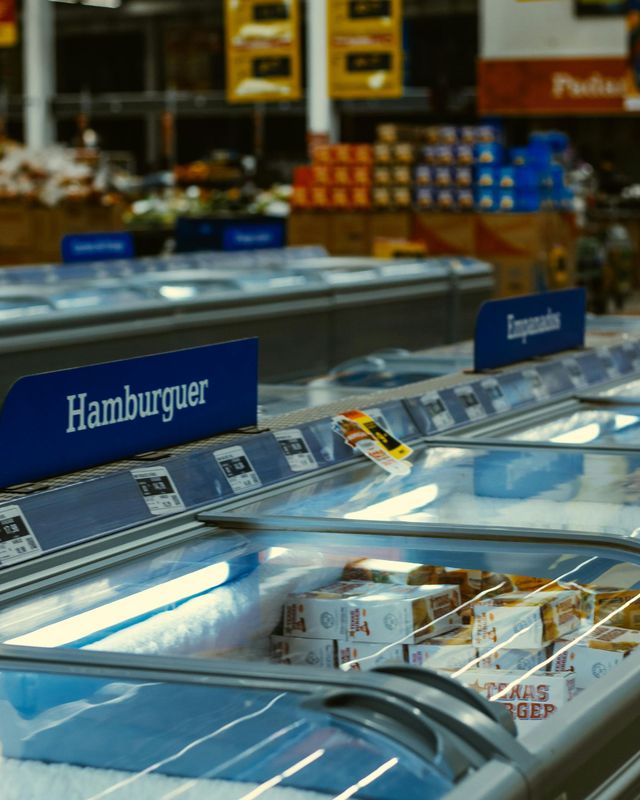Supermarket freezer case with a blue 