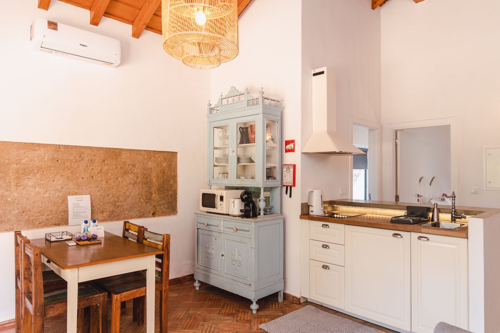 A kitchen with a table and chairs in it