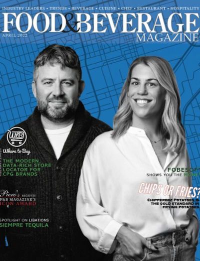 Food & Beverage Magazine cover with two smiling restaurant owners on a blue background