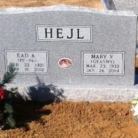 Gray granite double headstone for Ead A. and Mary V. Hejl, featuring dates of birth and death and a small central photo.