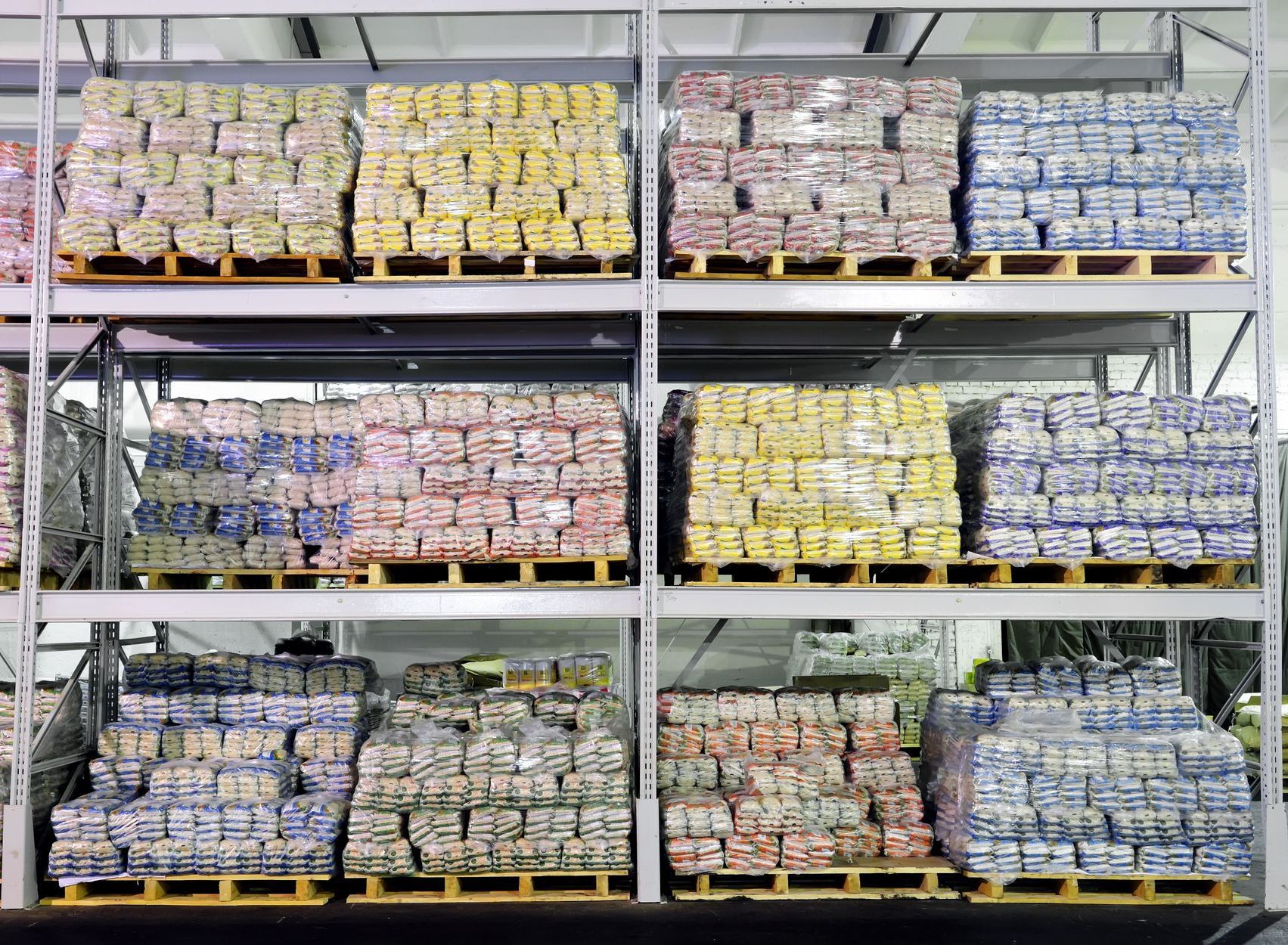 Stock room of a modern grocery store with pallets showing (standard) pallet sizes