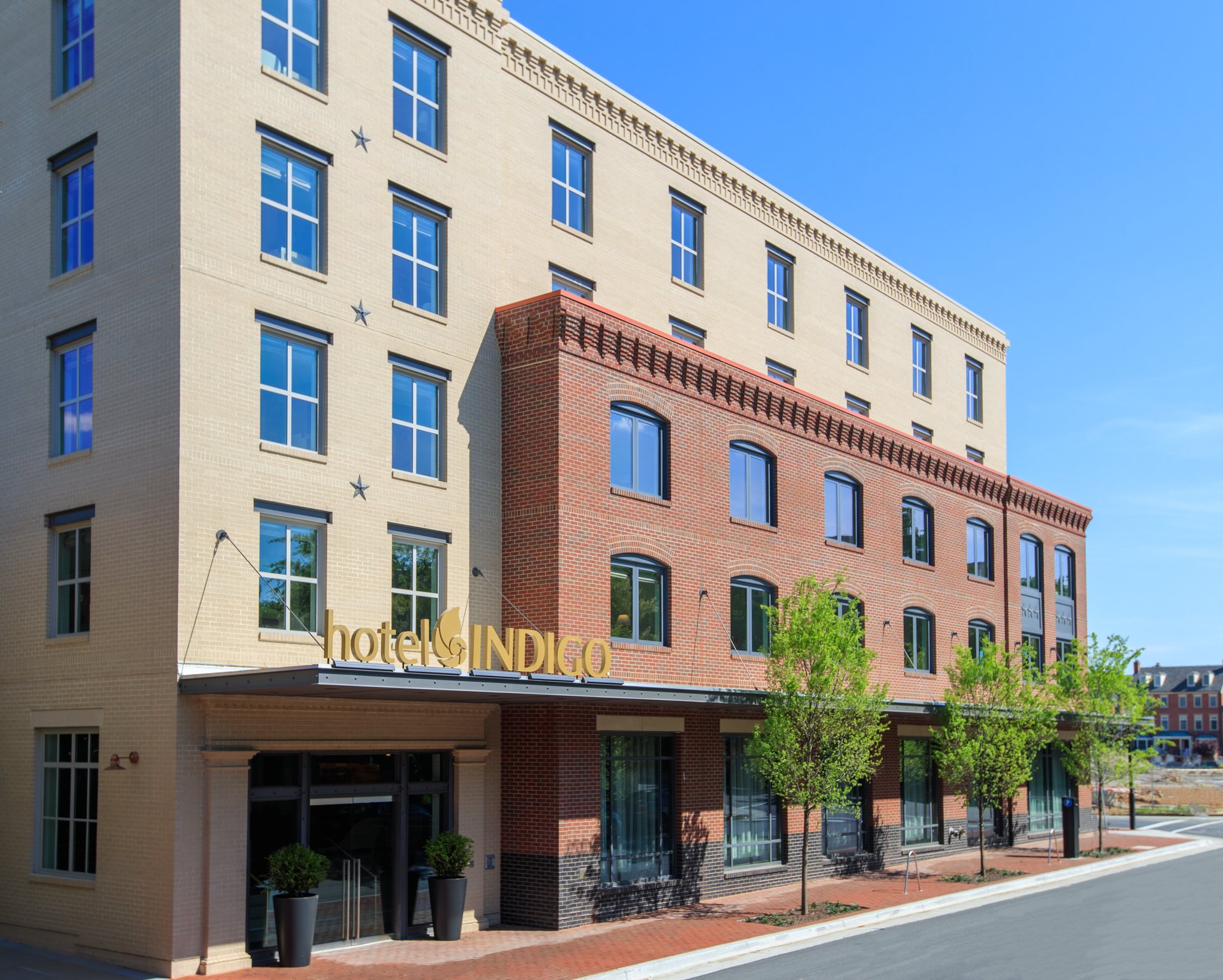 A large brick building with the word hotel indigo on it