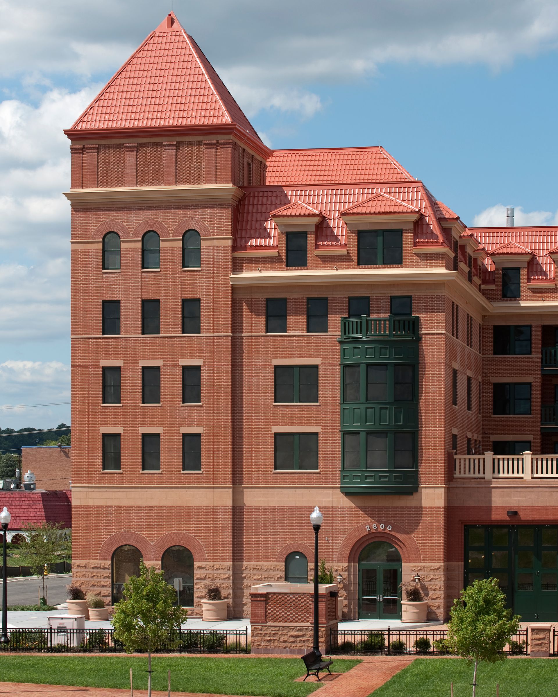 A large brick building with a red roof