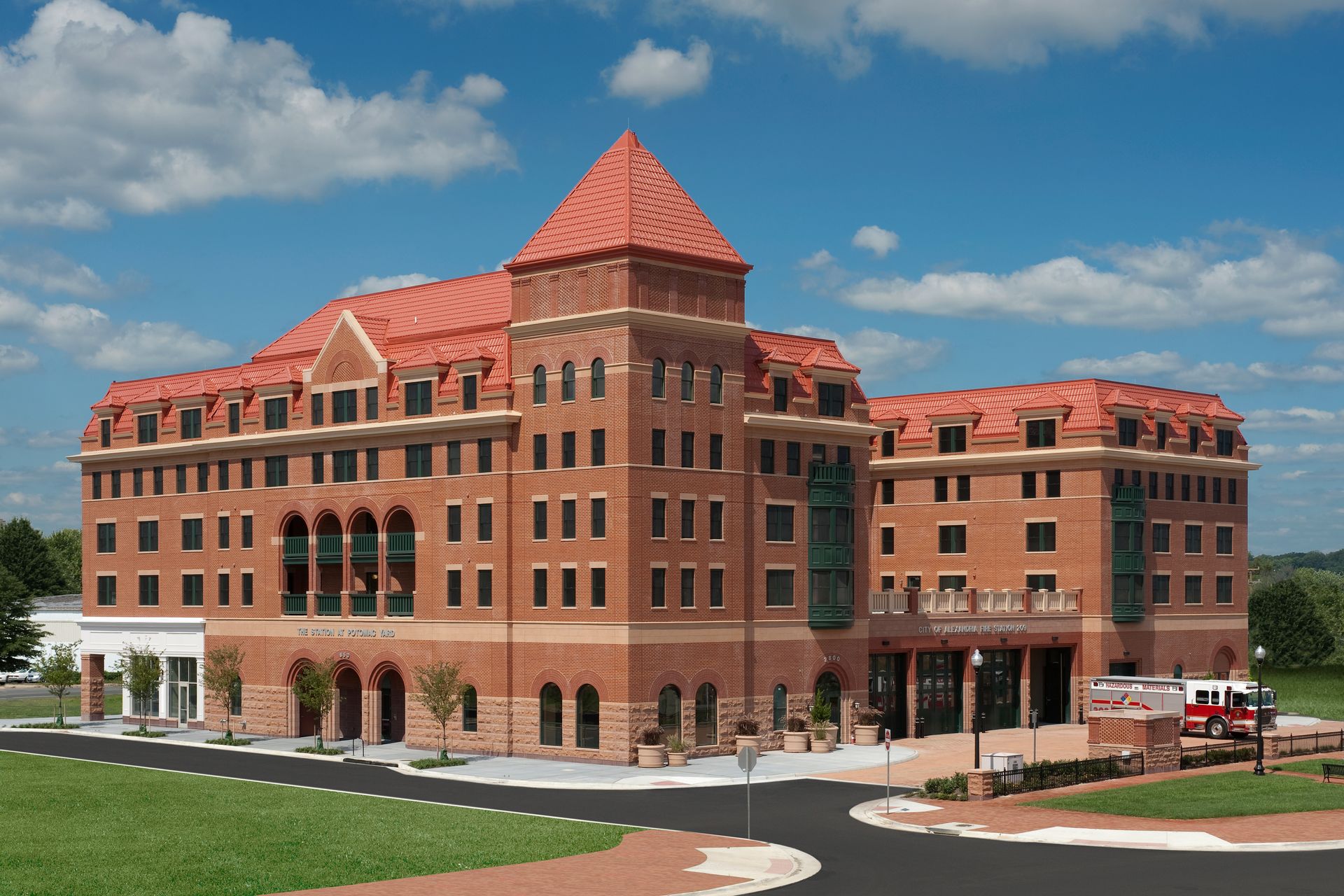 A large brick building with a red roof