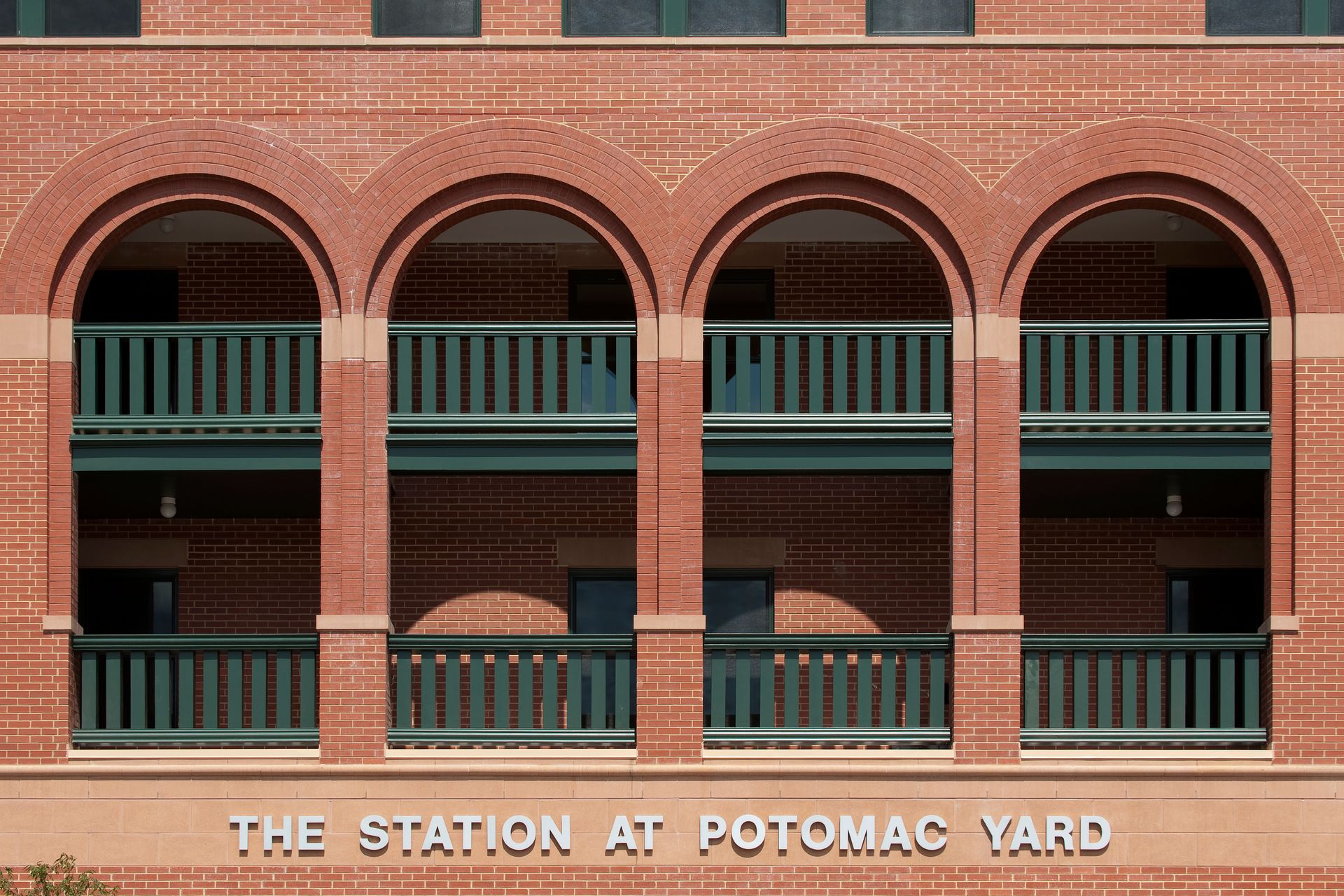 A brick building with the words the station at potomac yard on it