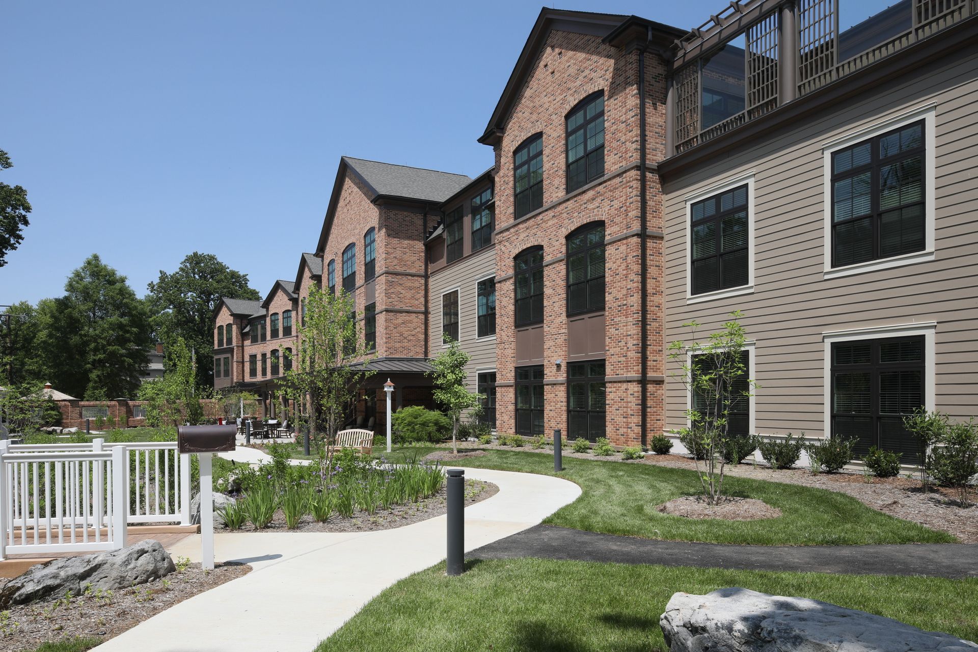 A large brick building with a walkway leading to it